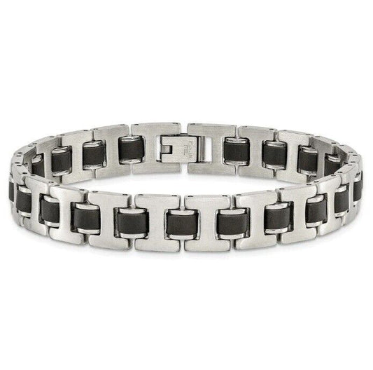 A silver stainless steel bracelet with black rubber inlay accents featuring a fold-over clasp.